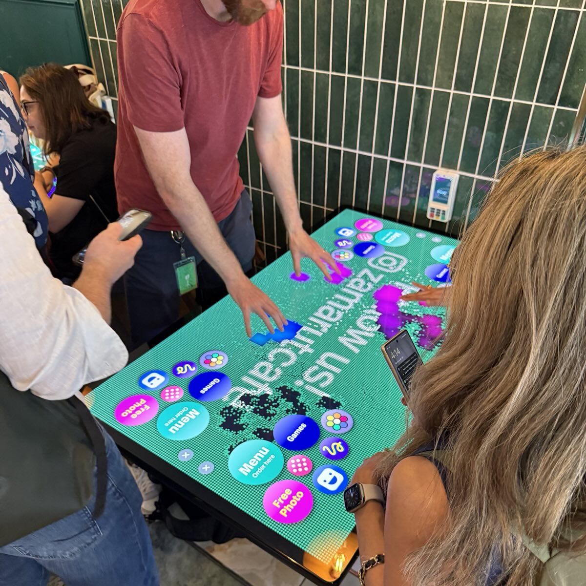 Guests playing on a Zamarut smart table